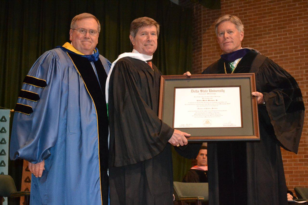 Delta State University President Emeritus Dr. John M. Hilpert (left) and new Delta State University President William N. LaForge (right) bestow Delta Council Executive Vice President Chip Morgan with one of the university’s highest honors - an honorary Doctor of Public Service degree.